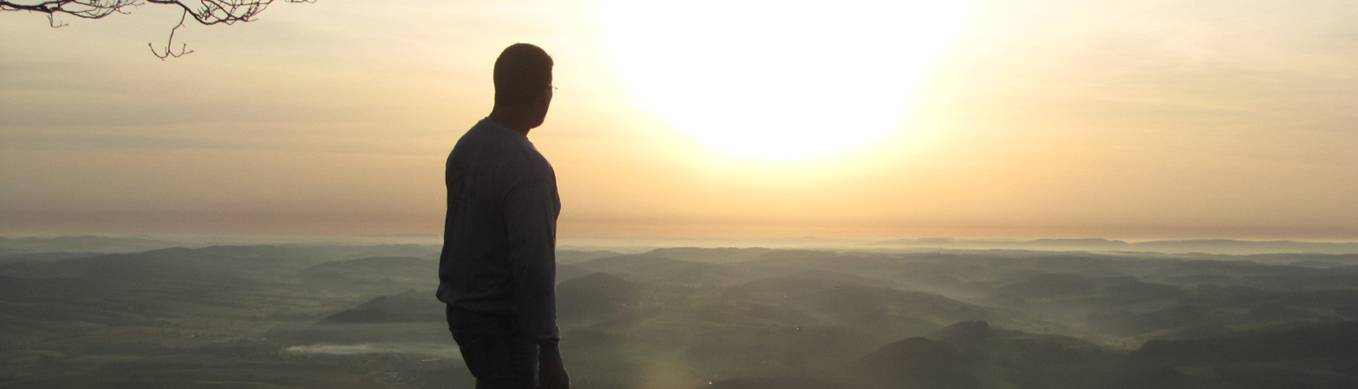 Jed Wood watching a sunrise from the Pinnacle.